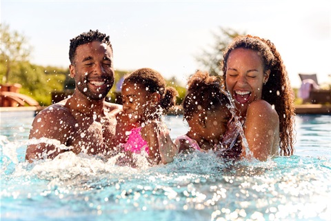 Family in swimming pool